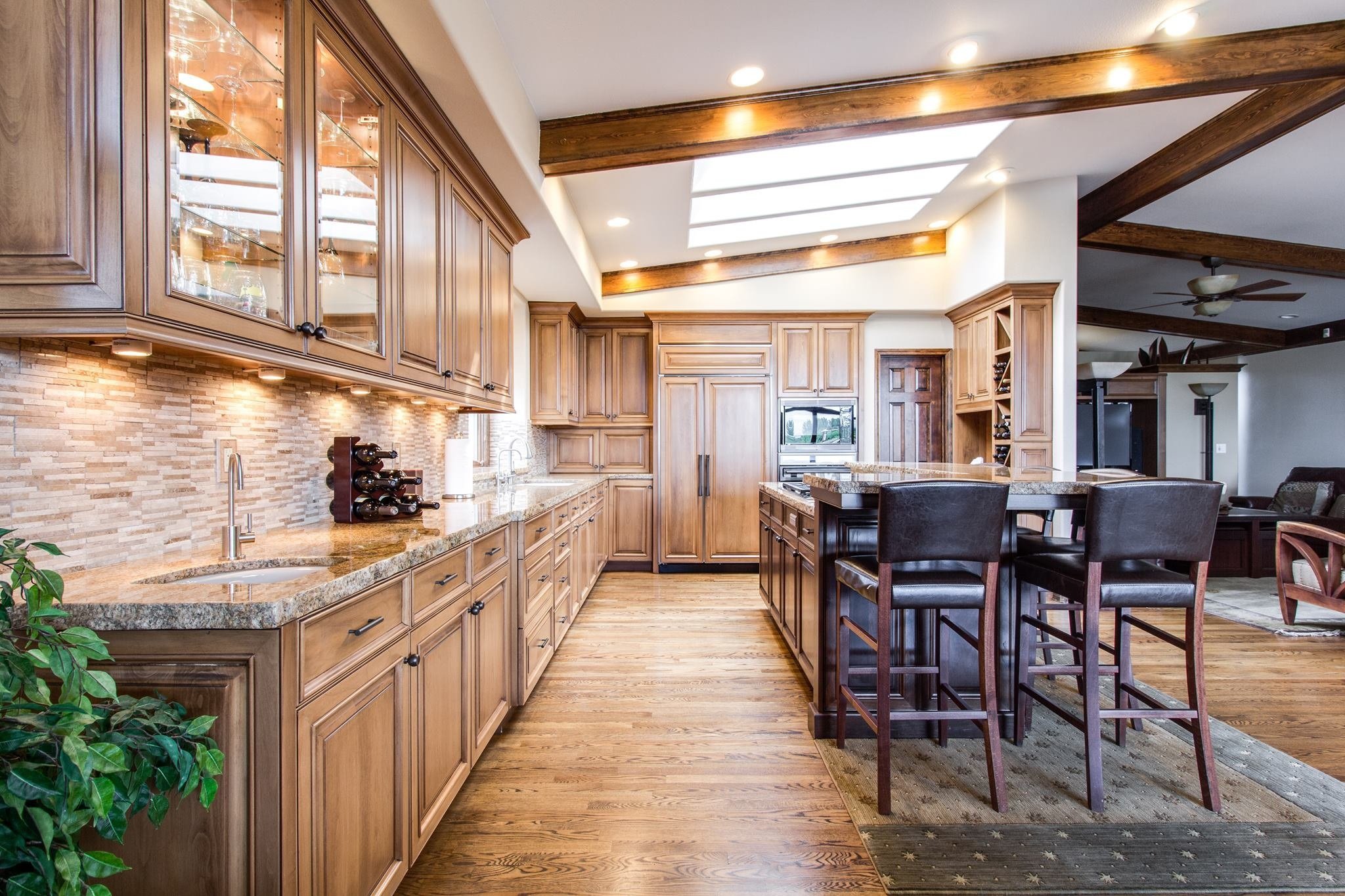 Entertaining pavilion: dramatic ceiling line and honest stone